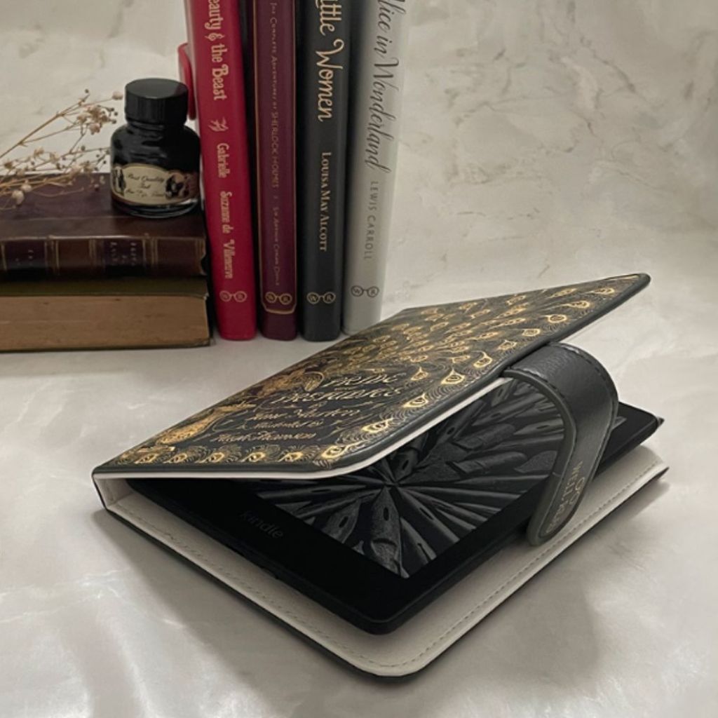 A Pride an Prejudice Kindle Cover partially opened, revealing kindle device, in a vintage style setting