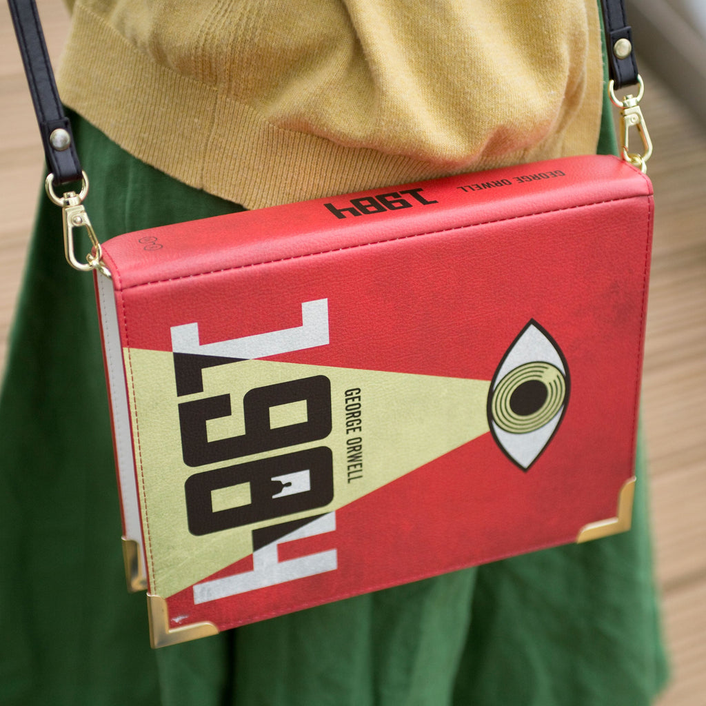 1984 Red and Yellow Handbag by George Orwell featuring Big Brother Eye design, by Well Read Co. - Model with bag