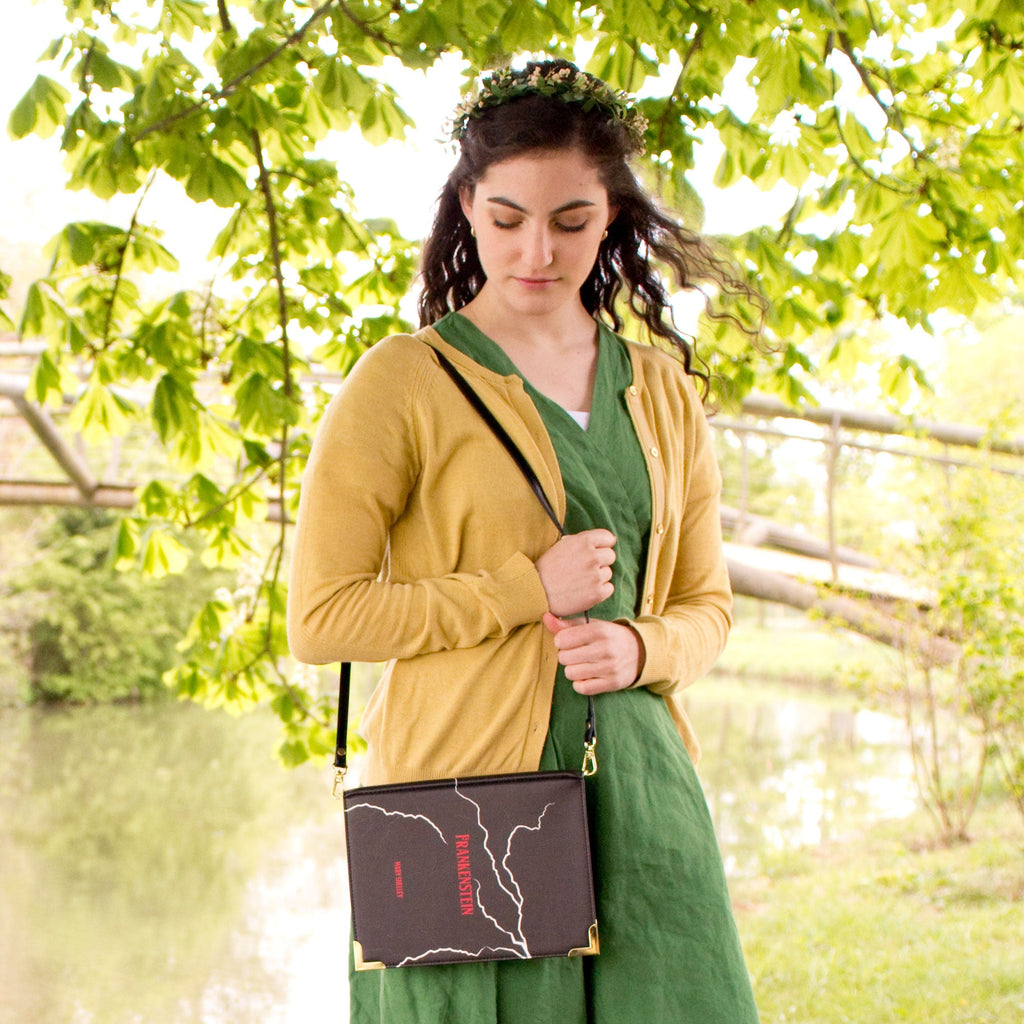 Frankenstein Black Handbag by Mary Shelley featuring White Lightning Strikes design, by Well Read Co. - Model wearing Green Dress