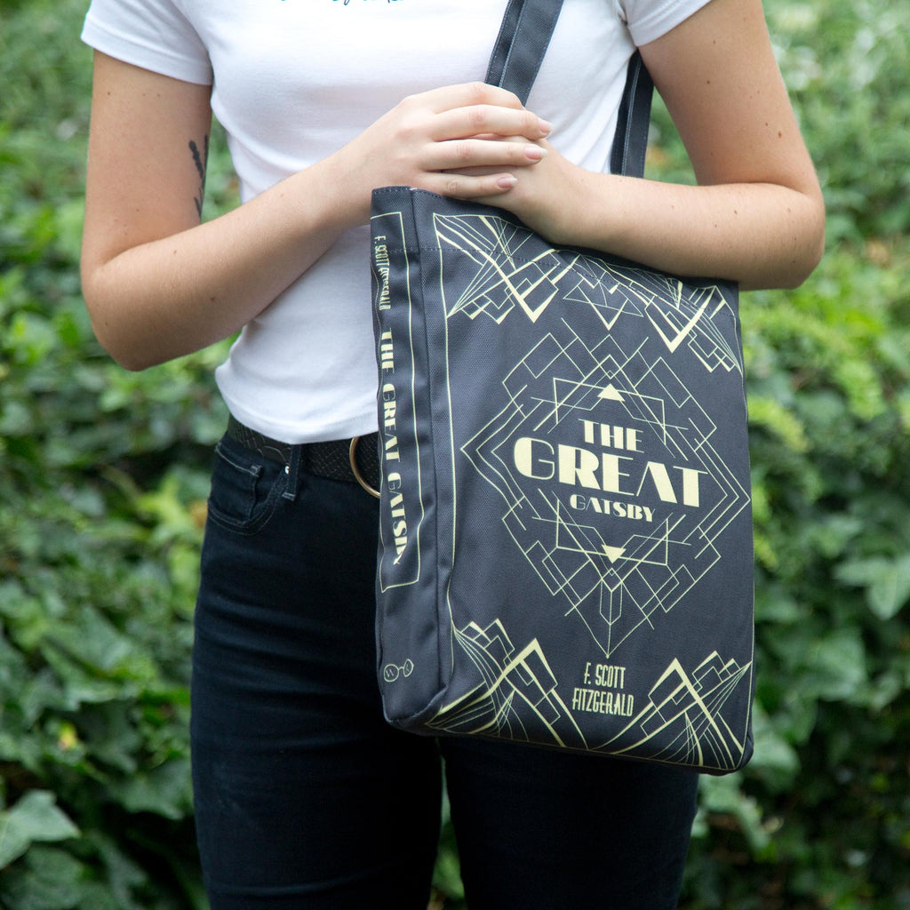 The Great Gatsby Black Tote Bag by F. Scott Fitzgerald featuring Art-Deco Lattice design, by Well Read Co. - Model Standing with Bag