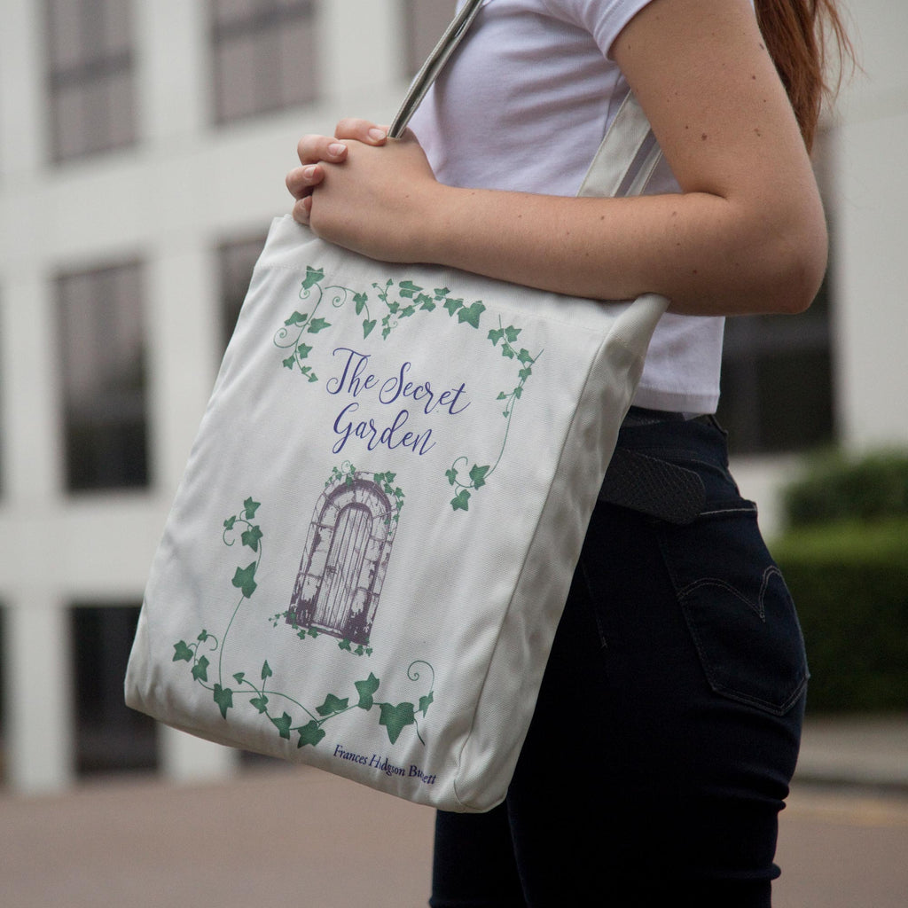 The Secret Garden Grey Tote Bag by F.H. Burnett featuring Gate and Ivy design, by Well Read Co. - Girl Standing with Bag