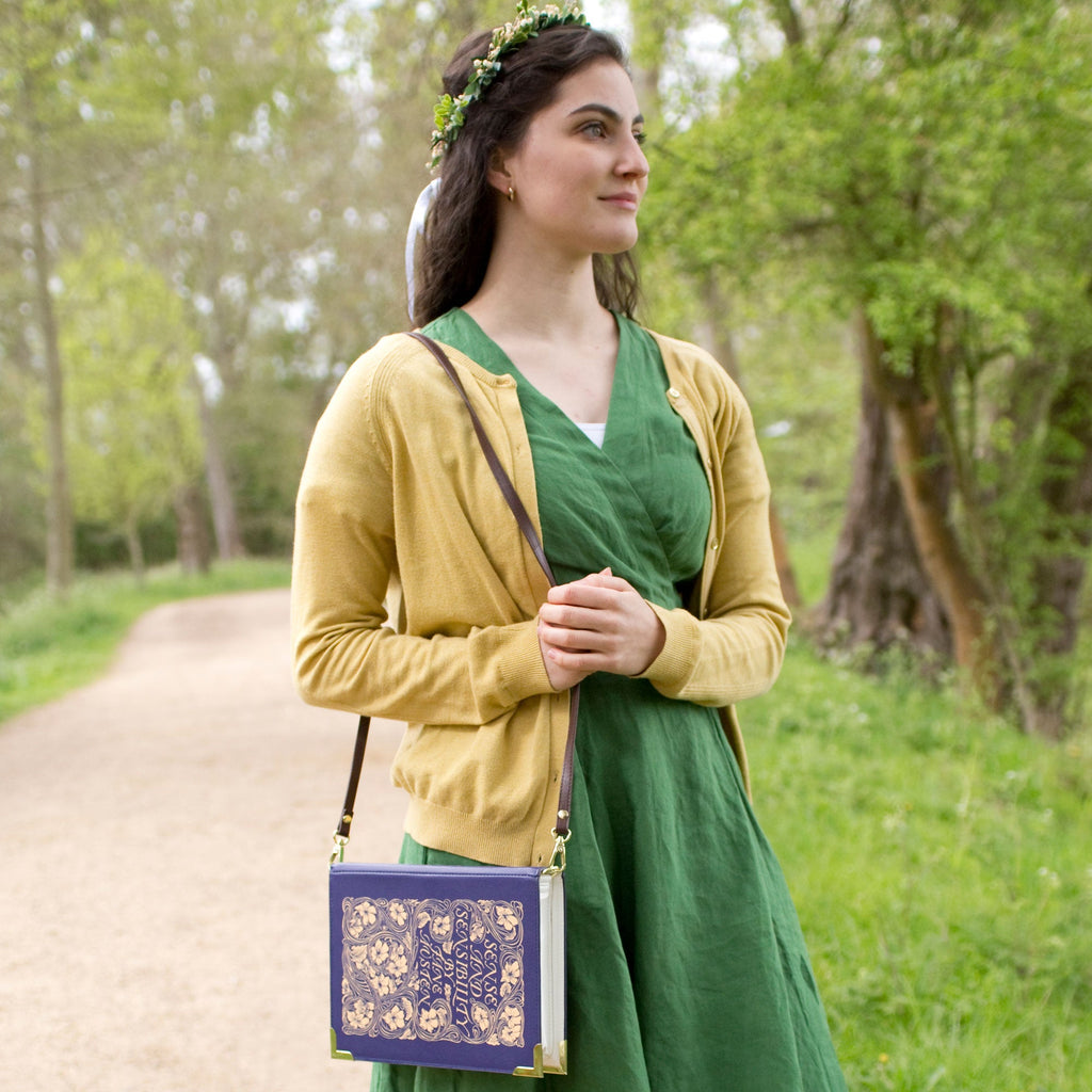 Sense and Sensibility Blue Handbag by Jane Austen with Ornate Gold Flower design, by Well Read Co. - Model in Green