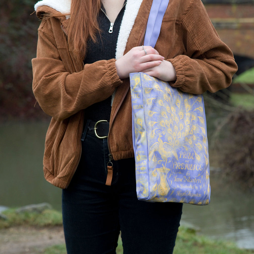 Pride and Prejudice Purple Tote Bag by Jane Austen with Peacock design, by Well Read Co. - Model Standing